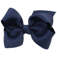ZOONAI navy 3-inch bow clip worn on toddler hair for photos