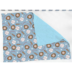 ZoUbqchY blue baseball baby blanket in crib setting complements nursery decor.