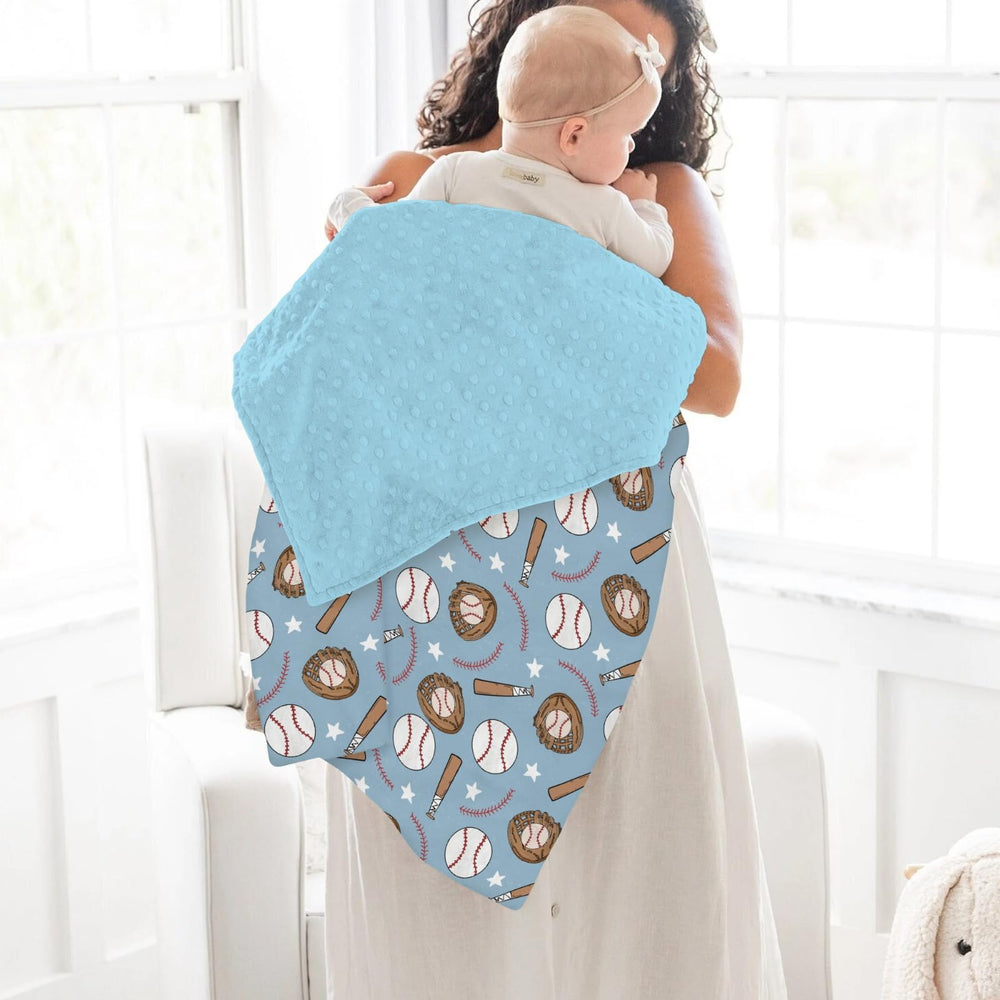 ZoUbqchY blue baseball baby blanket laid in stroller for on-the-go comfort.
