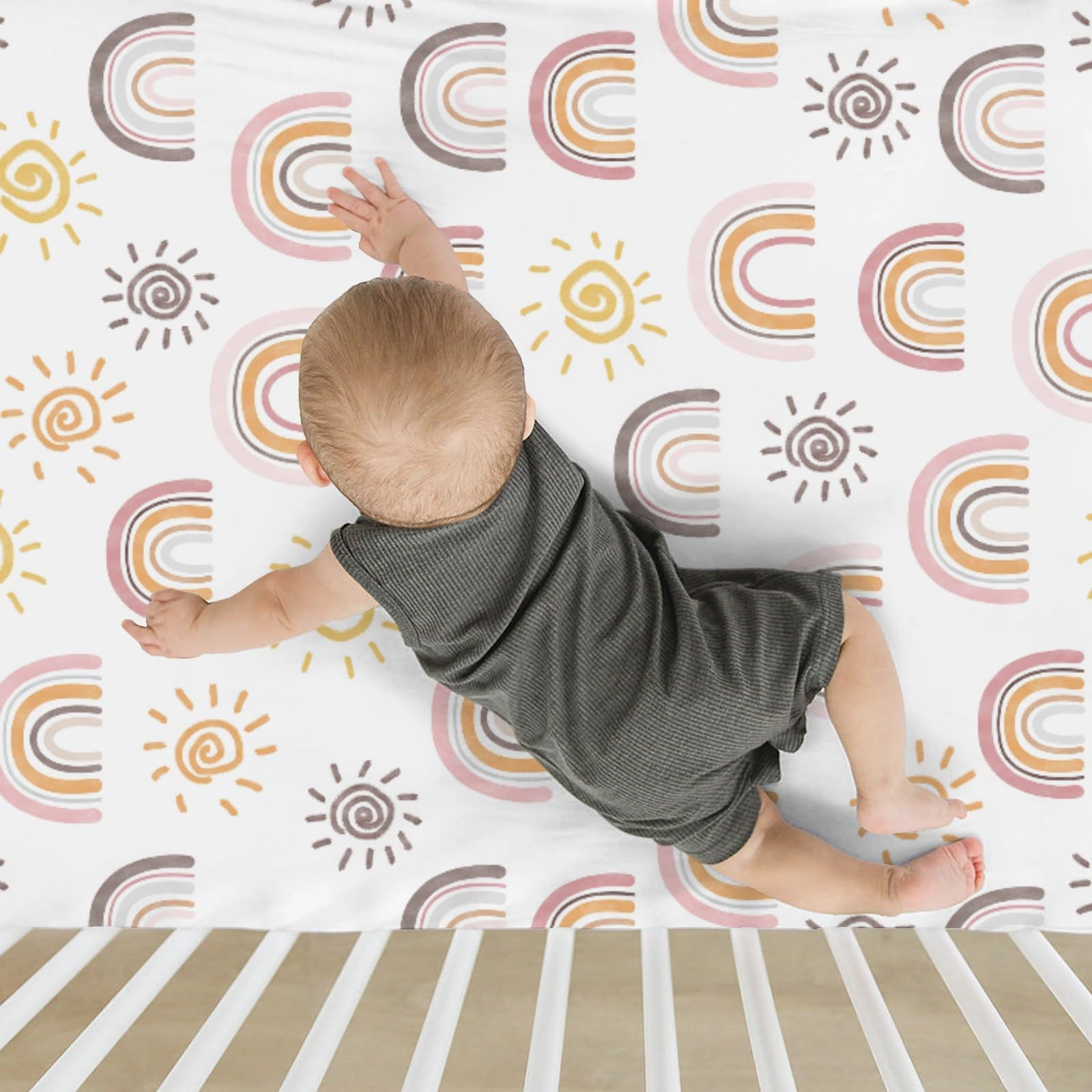 ZoUbqchY Rainbow print detail enhances a cozy, coordinated nursery theme