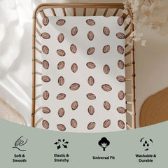 ZoUbqchY football-themed crib sheet with stretchy edges for easy, snug changes.