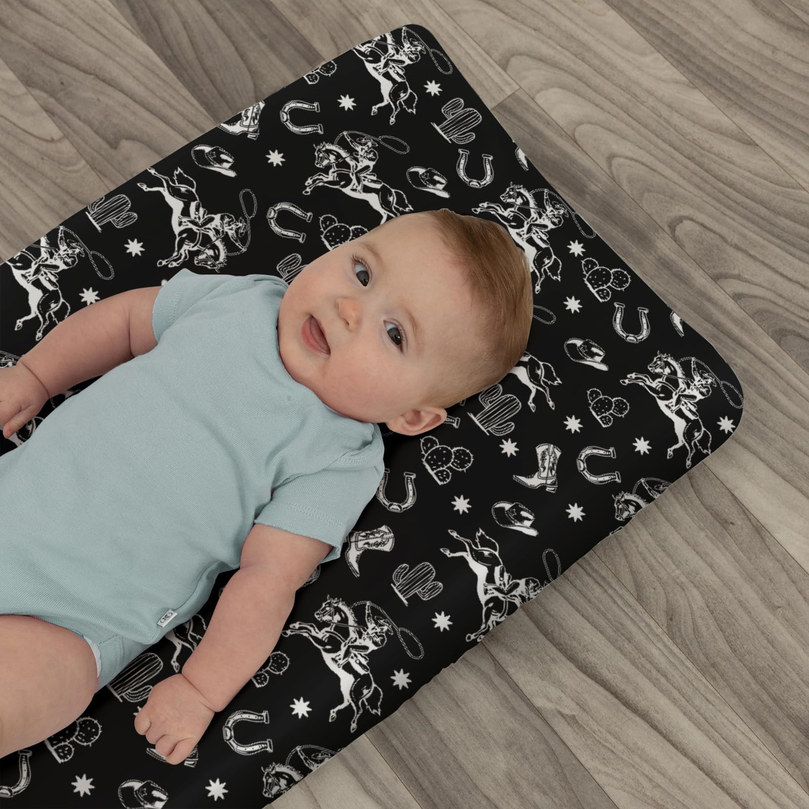 ZoUbqchY mix of patterns and muted colors creates cozy sleeping area and easy coordination with nursery decor.