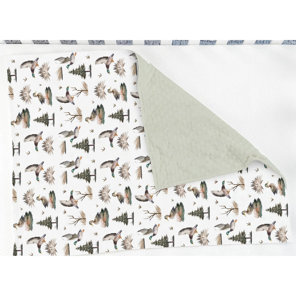 ZoUbqchY soft plush fabric close-up emphasizes gentle touch against baby's skin