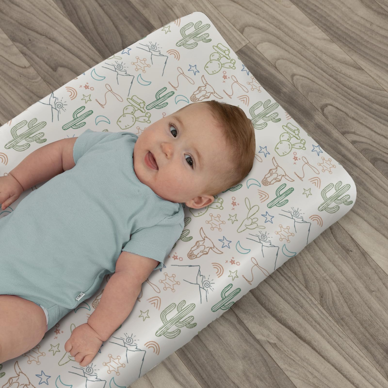 ZoUbqchy elastic-fit changing pad cover stays secure on 32x16 inch pads.
