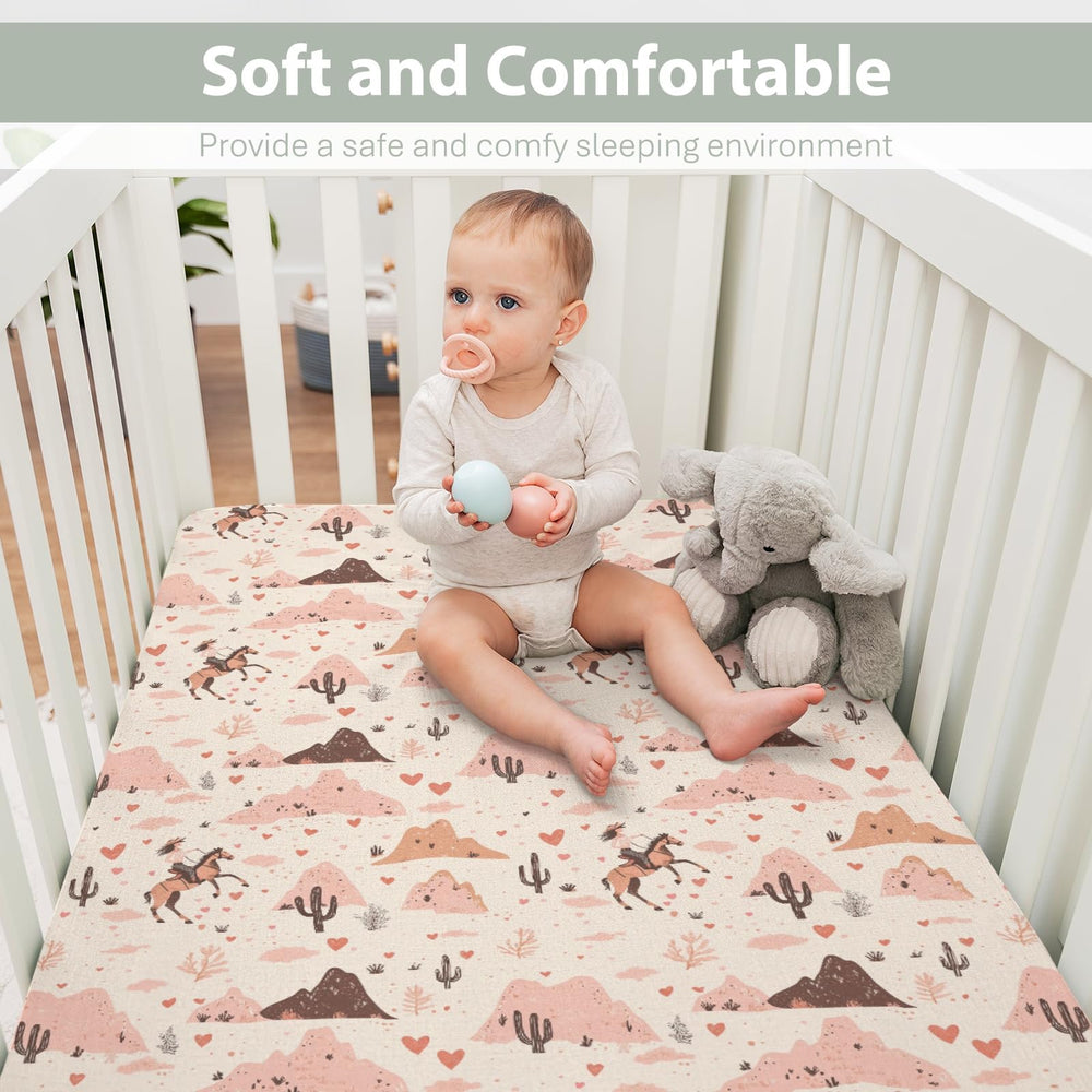 ZoUbqchY Pink desert-inspired crib sheet adds cozy style to nurseries.