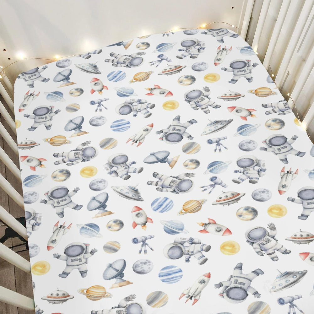 ZoUbqchY Space Astronaut Rocket Watercolor crib sheet for a cozy, engaging nursery.
