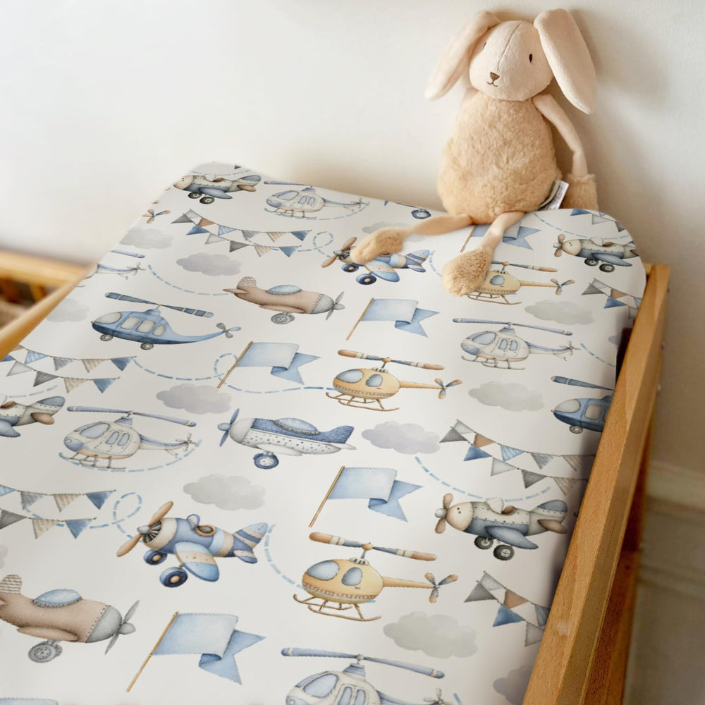 ZoUbqchY vintage aircraft changing pad cover blue coordinates with themed nurseries and easy care.