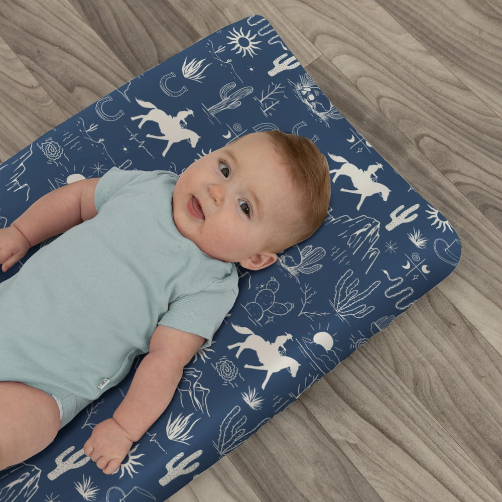 Zoubqchy wild west design on changing pad cover coordinates with theme.