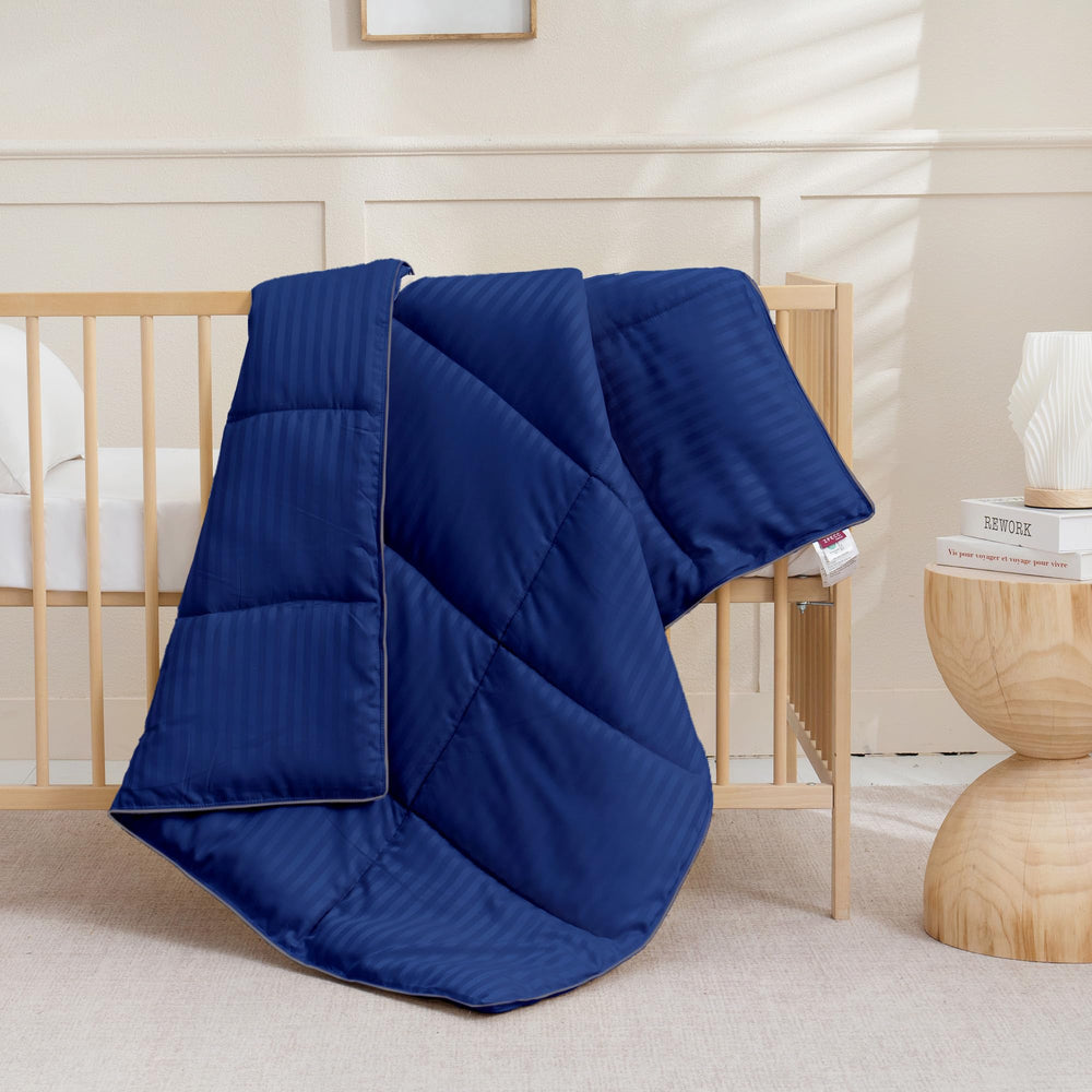 Daycare setting with ZPECC blue stripe comforter ready for rest