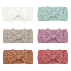ZURLEFY pink baby headbands with bows closeup to show soft, stretchy fit
