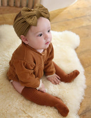 ZURLEFY beige headband bow set on infant, gentle stretch for versatile outfits.