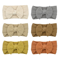 ZURLEFY rust baby headband bows close-up, soft nylon comfort for daily wear.