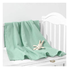 ZURLEFY Sage Green baby swaddle blanket close-up, soft muslin fabric for gentle newborn comfort.