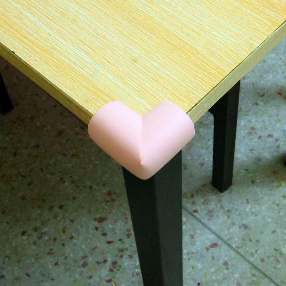 ZXUEZHENG pink foam corner guard on cabinet corner softens impact.