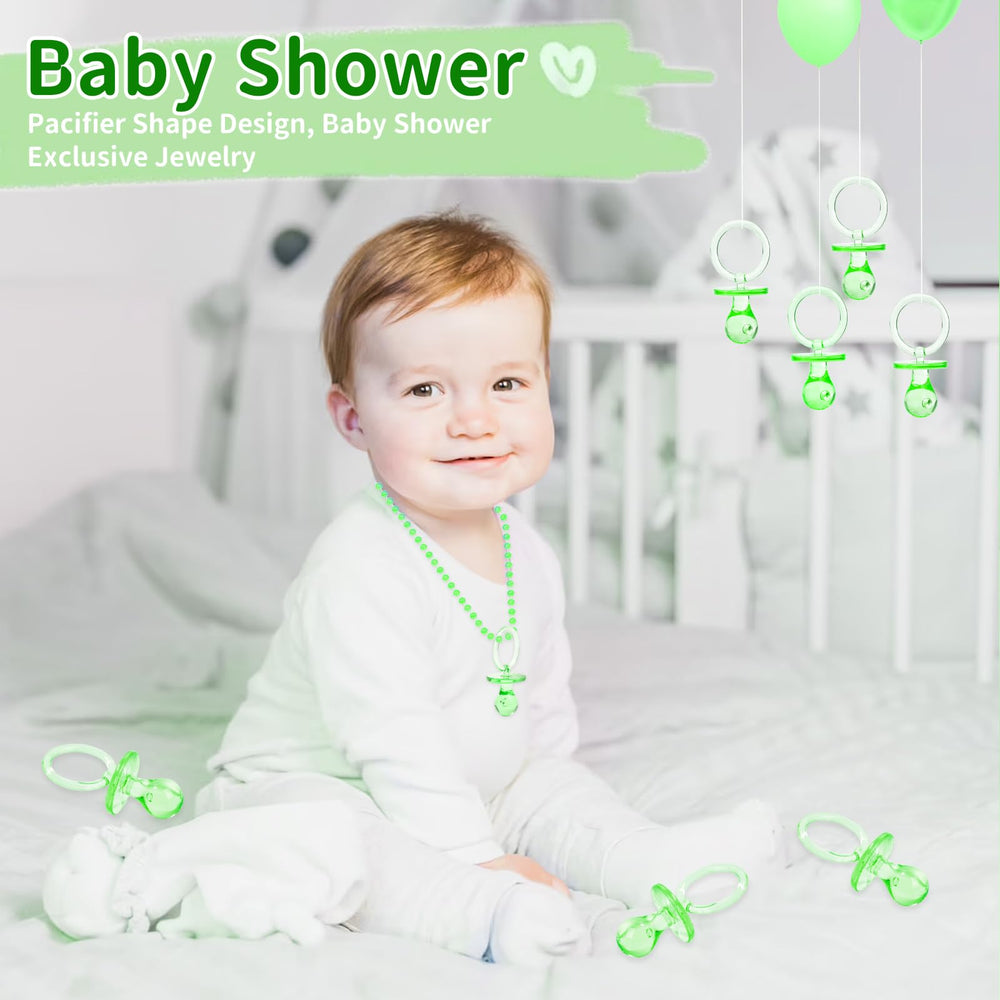ZYFLSQ green pacifiers as gender reveal table scatter.