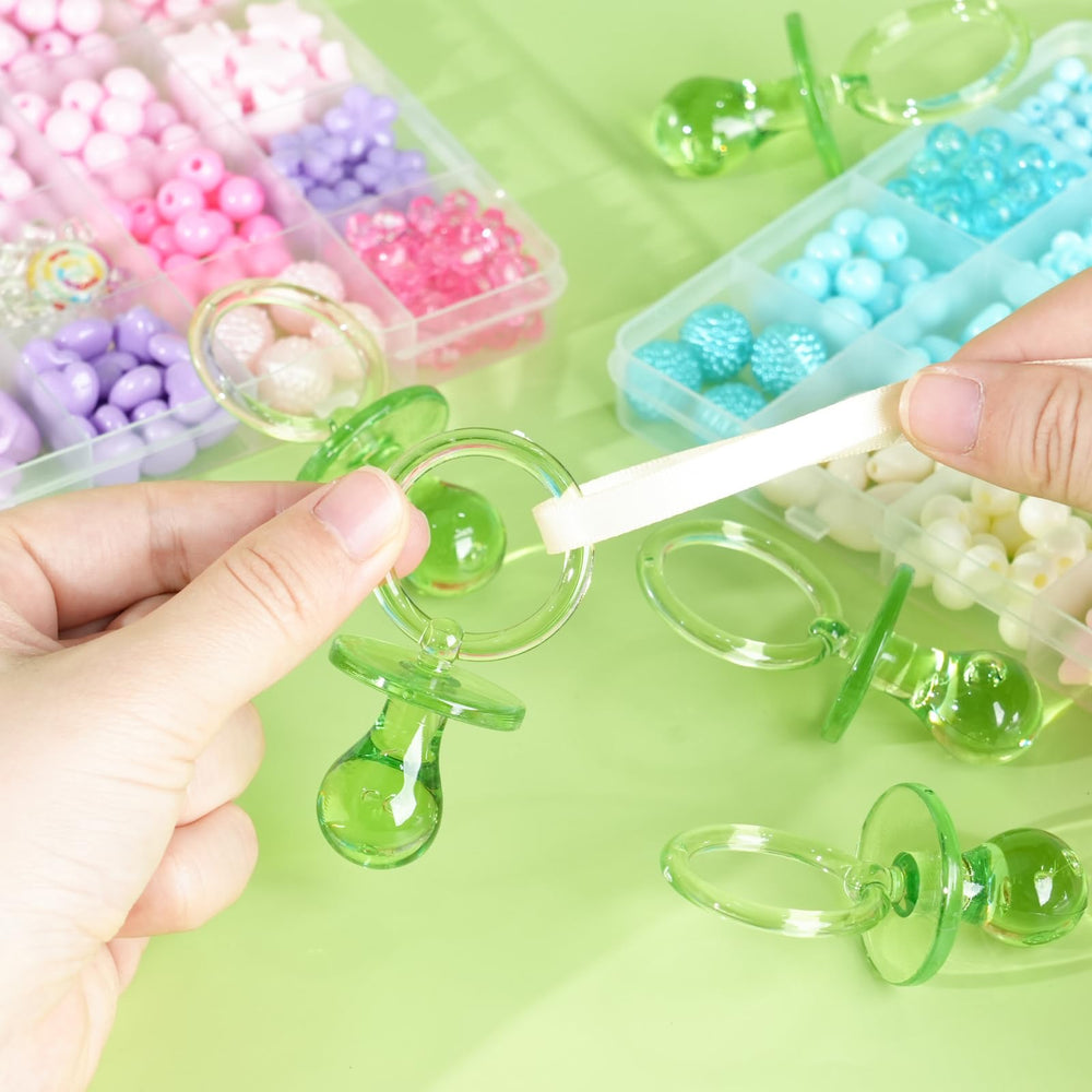ZYFLSQ green pacifiers used as Hunt Pacifier game props for fun.